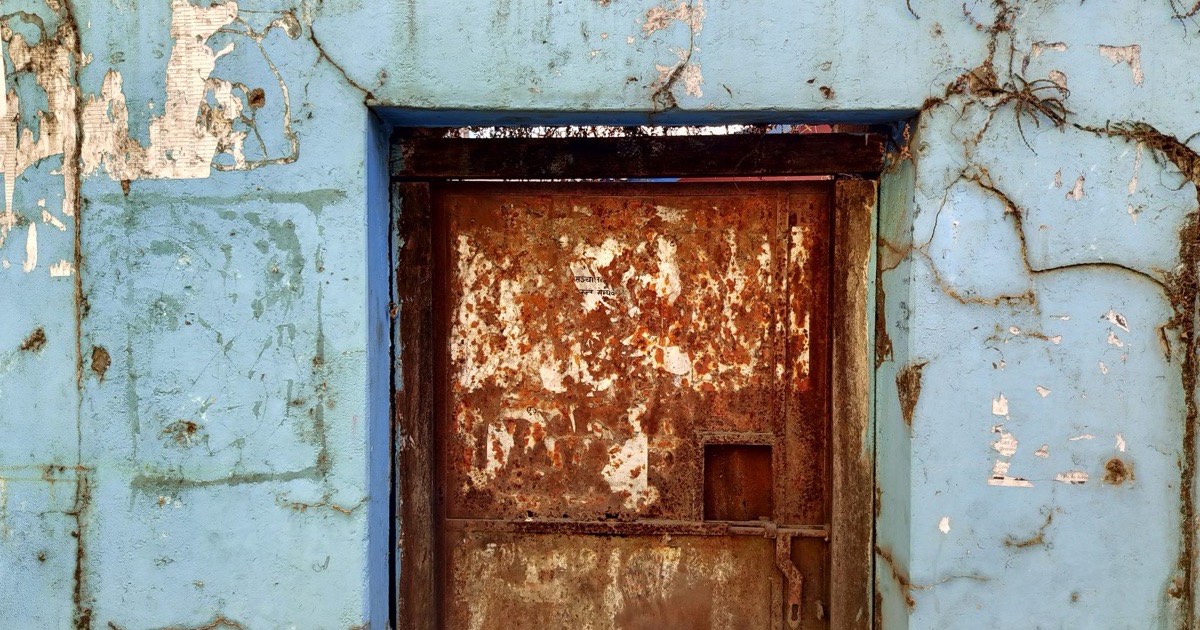 Old paint peeling from a surface ready for stripping